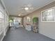 Bright and airy Florida room with ceiling fans at 9897 Se 178Th Pl, Summerfield, FL 34491
