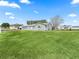 Well-maintained lawn and landscaping in front of the house at 9897 Se 178Th Pl, Summerfield, FL 34491