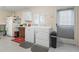 Laundry room with washer, dryer, and cabinets at 9897 Se 178Th Pl, Summerfield, FL 34491