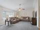 Bright living room with neutral decor and ceiling fan at 9897 Se 178Th Pl, Summerfield, FL 34491