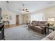 Living room with recliner and ceiling fan at 9897 Se 178Th Pl, Summerfield, FL 34491