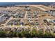 Aerial view of a large residential neighborhood with many houses and some open space at 10291 Se 69Th Ter, Belleview, FL 34420