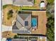 Aerial view of a single-Gathering home with a pool and solar panels on the roof at 10291 Se 69Th Ter, Belleview, FL 34420