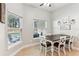 Cozy breakfast nook with a rustic wooden table and chairs, overlooking the pool at 10291 Se 69Th Ter, Belleview, FL 34420