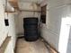 Unfinished basement area with shelving and tires at 1109 Pioneer Trl, Leesburg, FL 34748