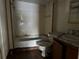 Bathroom with bathtub, toilet, and sink at 1109 Pioneer Trl, Leesburg, FL 34748