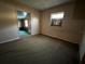 Bedroom with carpet and a window at 1109 Pioneer Trl, Leesburg, FL 34748