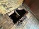 Damaged flooring with exposed subfloor and debris at 1109 Pioneer Trl, Leesburg, FL 34748