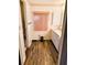 Clean bathroom with vanity, window, and wood-look flooring at 114 Chestnut St, Leesburg, FL 34748