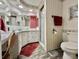 Bathroom featuring vanity with many mirrors and shower at 114 Chestnut St, Leesburg, FL 34748