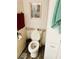 Small bathroom with toilet and storage at 114 Chestnut St, Leesburg, FL 34748