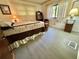 Spacious bedroom with a decorative bed, and light-filled windows at 114 Chestnut St, Leesburg, FL 34748