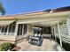 The spacious carport provides covered parking with easy access to the home and a charming golf cart at 114 Chestnut St, Leesburg, FL 34748