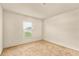 Simple bedroom with neutral walls and carpeted floors at 12018 Indian Grass Way, Leesburg, FL 34788