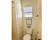 Small bathroom with toilet and decorative framed quote at 123 Pyracantha Ln, Leesburg, FL 34748