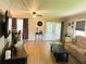 Bright living room featuring a view of a screened porch and plenty of natural light at 123 Pyracantha Ln, Leesburg, FL 34748