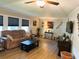 Living room showcasing hardwood floors and ample natural light at 123 Pyracantha Ln, Leesburg, FL 34748