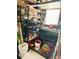 Organized storage area with shelving unit and various items at 123 Pyracantha Ln, Leesburg, FL 34748