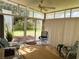 Relaxing sunroom with sliding glass doors leading to the backyard at 123 Pyracantha Ln, Leesburg, FL 34748