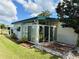 Enclosed sunroom with tile flooring and sliding doors at 123 Pyracantha Ln, Leesburg, FL 34748