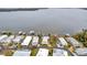 Aerial view showcasing waterfront property and homes with private docks at 13 Sunrise Trl, Fruitland Park, FL 34731