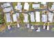 Overhead view of waterfront homes with docks, showcasing community layout near the water's edge at 13 Sunrise Trl, Fruitland Park, FL 34731