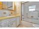 Bathroom featuring vanity with storage, bathtub, shower, and tile flooring at 13 Sunrise Trl, Fruitland Park, FL 34731