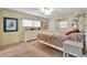 Spacious bedroom with dresser and large bed at 13 Sunrise Trl, Fruitland Park, FL 34731