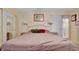 Main bedroom with a double bed and ensuite bathroom access at 13 Sunrise Trl, Fruitland Park, FL 34731