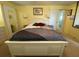 Bedroom featuring neutral carpeting, and a comfortable king-sized bed at 13 Sunrise Trl, Fruitland Park, FL 34731