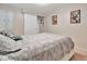 Bedroom featuring neutral carpeting, a comfortable queen-sized bed, and closet at 13 Sunrise Trl, Fruitland Park, FL 34731