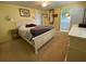 Bedroom showcasing neutral carpeting, and a comfortable king-sized bed at 13 Sunrise Trl, Fruitland Park, FL 34731