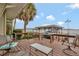 Spacious wooden deck with comfortable seating, perfect for enjoying waterfront scenery at 13 Sunrise Trl, Fruitland Park, FL 34731