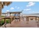 Inviting wooden deck offering picturesque waterfront views and a peaceful outdoor living space at 13 Sunrise Trl, Fruitland Park, FL 34731