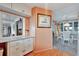 Open dining area with white table and chairs, view into kitchen at 13 Sunrise Trl, Fruitland Park, FL 34731