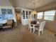 Inviting dining room featuring a round table, elegant chairs, and a built-in display cabinet at 13 Sunrise Trl, Fruitland Park, FL 34731