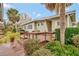 Charming home featuring a wooden deck overlooking a beautifully landscaped yard with mature trees at 13 Sunrise Trl, Fruitland Park, FL 34731