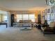 Spacious living room showcasing comfortable seating, neutral tones, and stylish decor at 13 Sunrise Trl, Fruitland Park, FL 34731