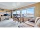Cozy living space with a view of the water, desk, and a comfortable seating area at 13 Sunrise Trl, Fruitland Park, FL 34731