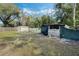 Large backyard with storage shed and fence at 1301 Sand Pine Ave, Ocoee, FL 34761