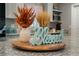 Kitchen island with wooden lazy susan and autumn decor at 1301 Sand Pine Ave, Ocoee, FL 34761