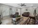 Spacious living room with leather furniture and wood-look floors at 1301 Sand Pine Ave, Ocoee, FL 34761