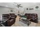 Open concept living room with leather furniture and a ceiling fan at 1301 Sand Pine Ave, Ocoee, FL 34761