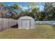 White metal storage shed in backyard at 1301 Sand Pine Ave, Ocoee, FL 34761