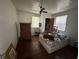 Cozy bedroom with hardwood floors and a dresser at 13369 Cr 719, Webster, FL 33597