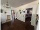 Bright hallway with hardwood floors, chandelier, and views into other rooms at 13369 Cr 719, Webster, FL 33597