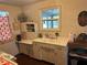 Small retro kitchen with white cabinets and appliances at 13369 Cr 719, Webster, FL 33597