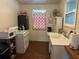 Kitchen with retro stove, microwave, and sink at 13369 Cr 719, Webster, FL 33597