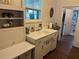 Retro kitchen with white cabinets and a sink at 13369 Cr 719, Webster, FL 33597