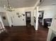 Open living area with wood floors and chandelier at 13369 Cr 719, Webster, FL 33597